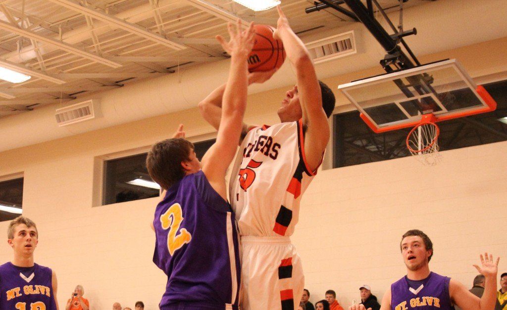 Chris Halpin rises above his opponent to nail the field goal in the Miners' win over Mt. Olive last week. 