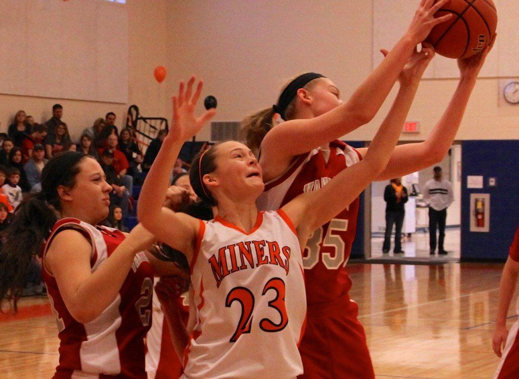 Bailey Jarman fights for a rebound in the Lady Miners' loss to Vandalia yesterday. 