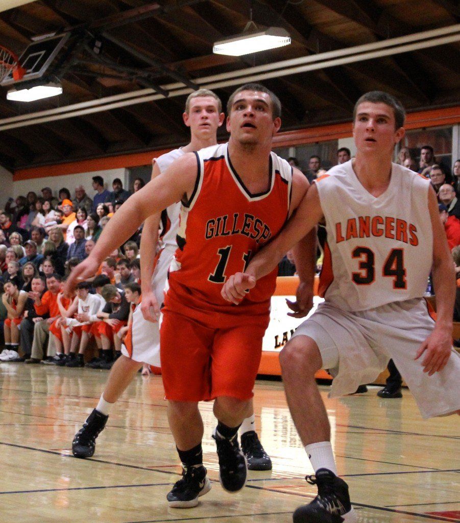 Derrick Tiburzi fights around his defender to get the rebound off a free throw attempt in last night's loss to Raymond. 