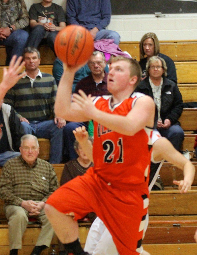 Eli Fox lays the basketball in softly in the Miners loss to Raymond last night. 