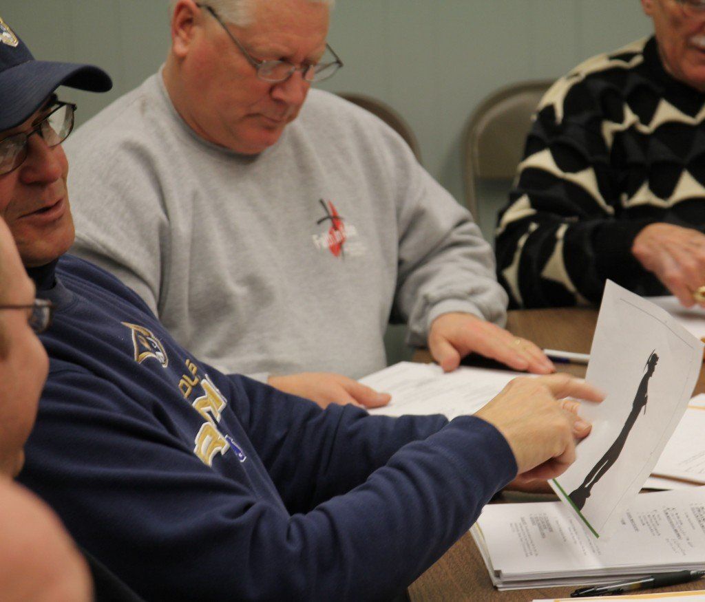Frank Barrett looks at a drawing of the Miner sculpture during Gillespie's council meeting last week. The sculpture will be installed in Gillespie by the Route 66 organization. Find out more. 