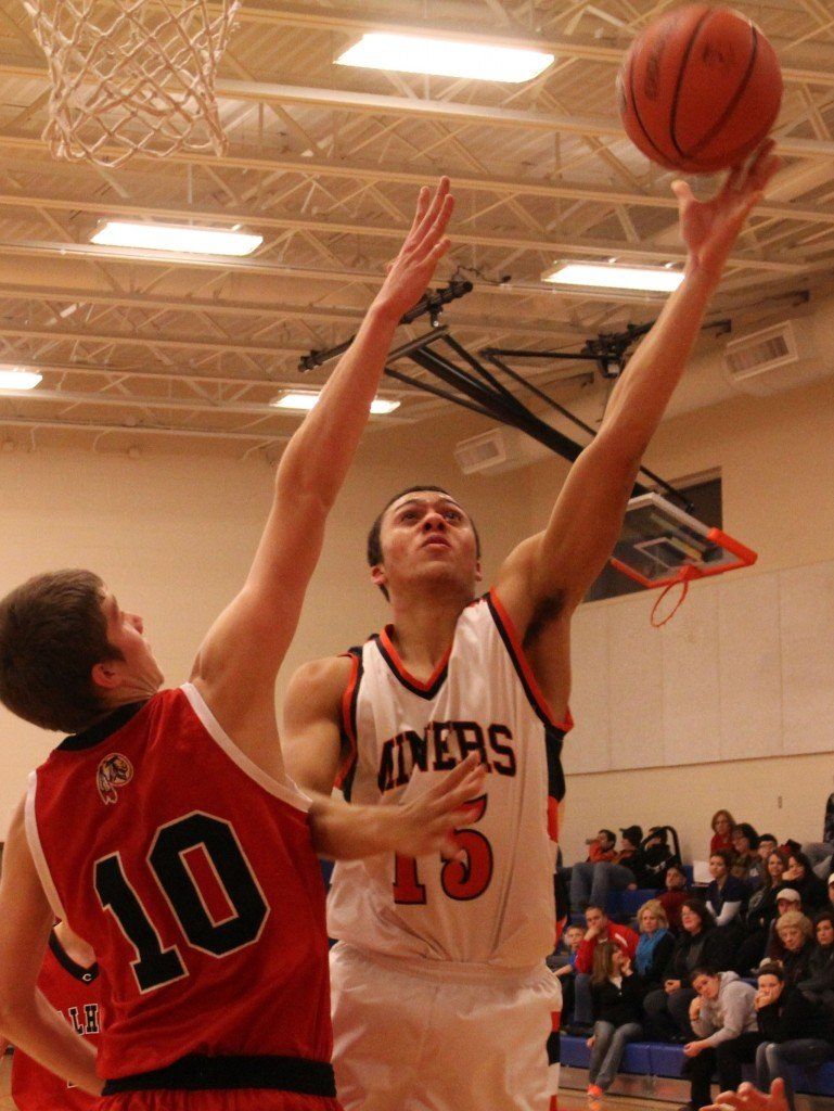 Chris Halpin lays the basketball in the hoop for easy basket in the Miners' 51-59 loss to Calhoun. 