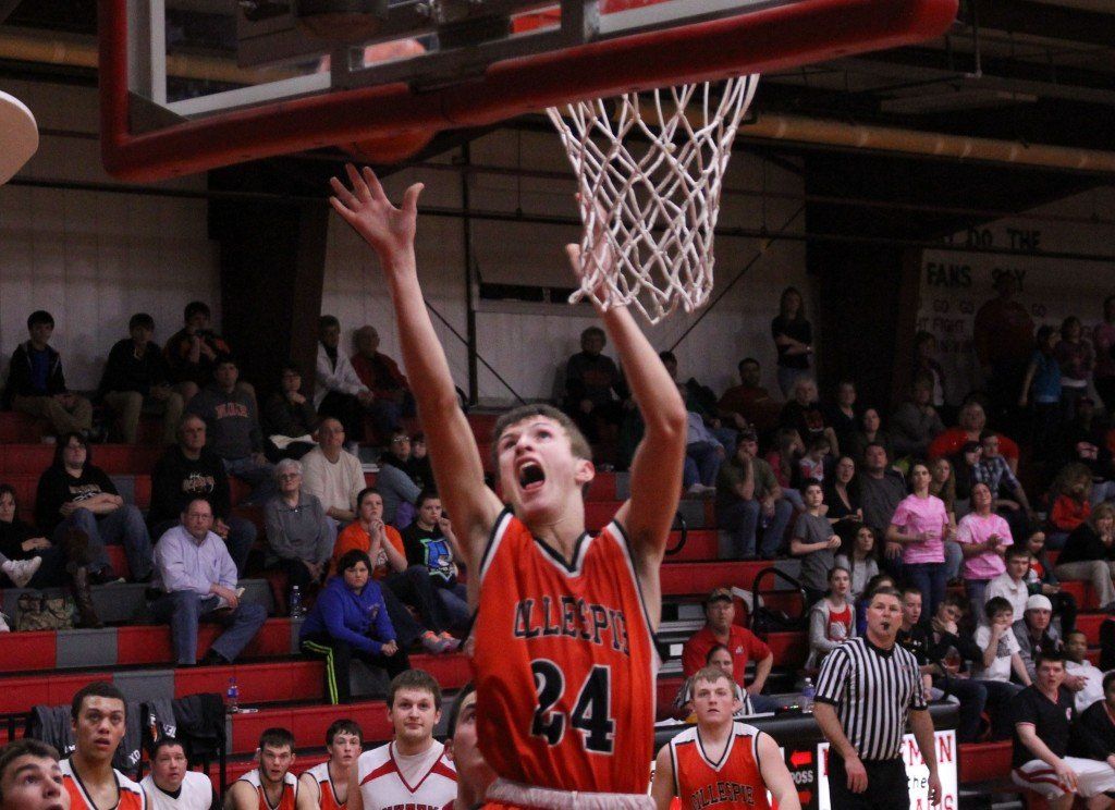 Evan Price puts the basketball against the backboard for an easy bucket. The Miners split last week as they lost to Bunker Hill, but beat Staunton. The boys will play Hillsboro in the Carlinville Regional Monday evening. 
