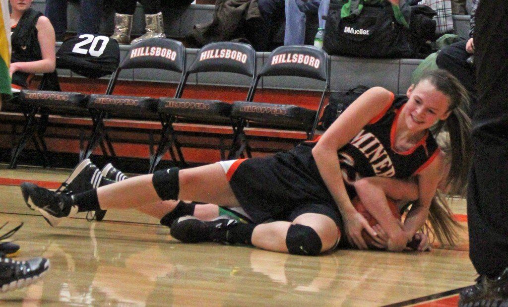Bailey Jarman fights for possession of the ball in the Lady Miners' loss to Southwestern. 