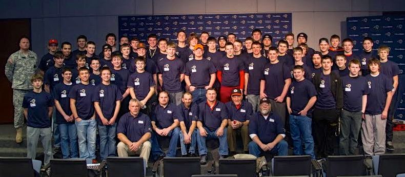 The Gillespie Miner football team pictured in their National Guard shirts for Coach Burns during the award ceremony for High School Football Team of the Year. Find out more. 