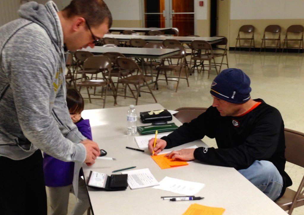 Jay Ronald, boys commissioner for Gillespie C.I.S.L. baseball, signs a boy up to play during signups last week. There were also be signups this Wednesday, February 12, from 5:30 to 7:30 p.m. at the Gillespie Civic Center. 