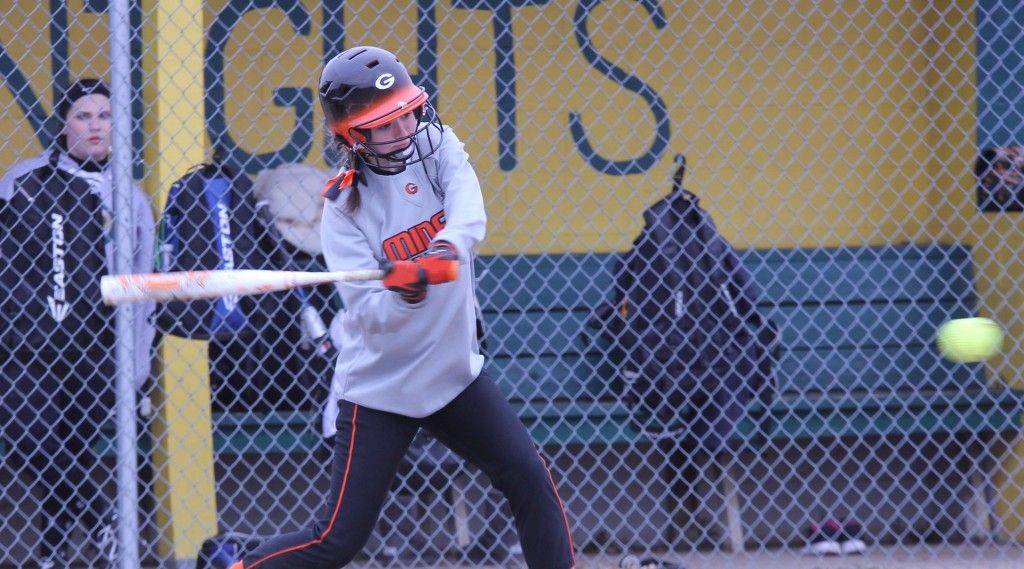 Abby Eccles swings through the pitch yesterday at Metro East Lutheran. In the first week of softball action, the team went 2-1 with wins over Ramsey and Morrisonville and a loss to Metro East Lutheran. 