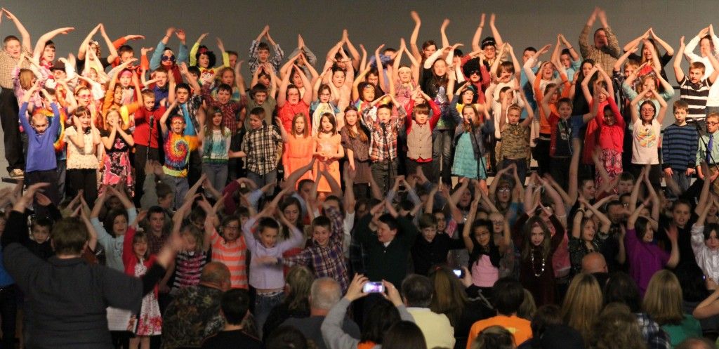 Fourth and fifth graders of Ben-Gil Elementary School teamed up this week and presented a 70's summer concert. Pictured here, students sing the Y.M.C.A.