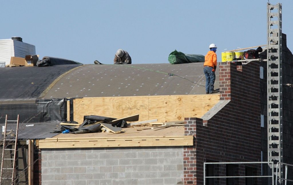 Crews continue laying brick this week and work on roofing new roof that connects the new front wall to the existing gym. 