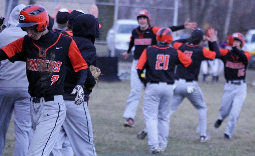The boys baseball team gets hyped up after the team rallies in the seventh inning and scores 5 runs after trailing Mt. Olive 3-7 before the seventh inning. 