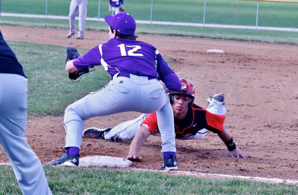 Chris Halpin dives back to first base in Gillespie's 5-4 win over Litchfield this week. The Miners baseball team went 2-3 this week.