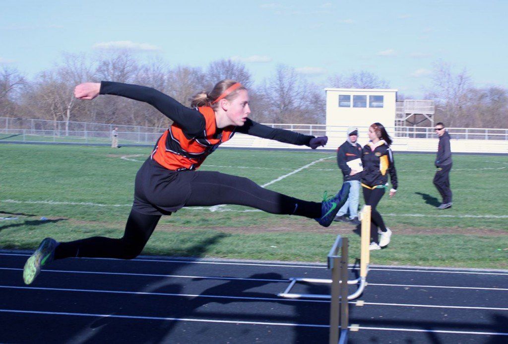 Amanda Schmidt clears the hurdle in the 100 meter hurdles during the Southwestern relays.