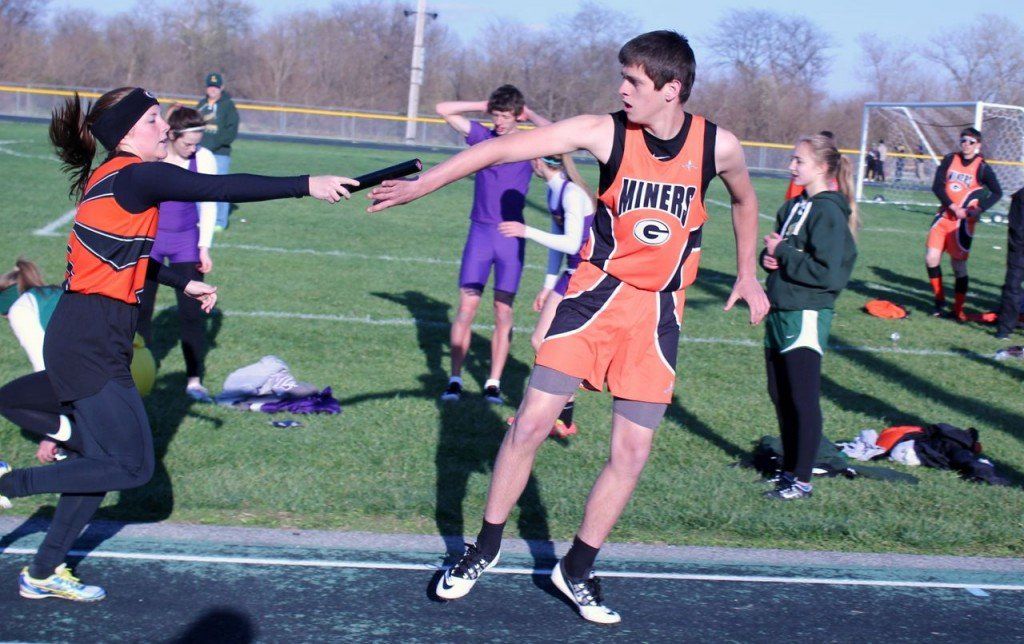 Ellen Gray hands the baton off to Zach Carr during the Southwestern Relays last week.
