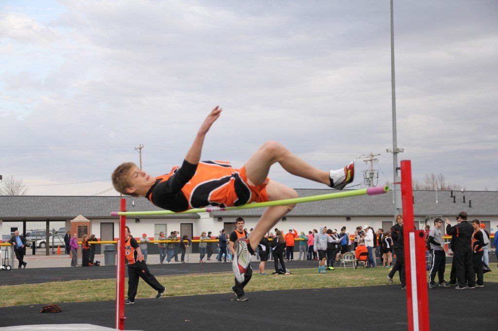 Keagan West clears the bar in the high jump field event. 