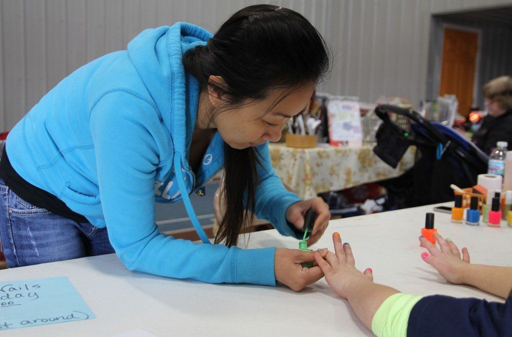 126 Nails and Spa of Carlinville paint nails during the Ageless Vendor Fair on Saturday, April 5. 