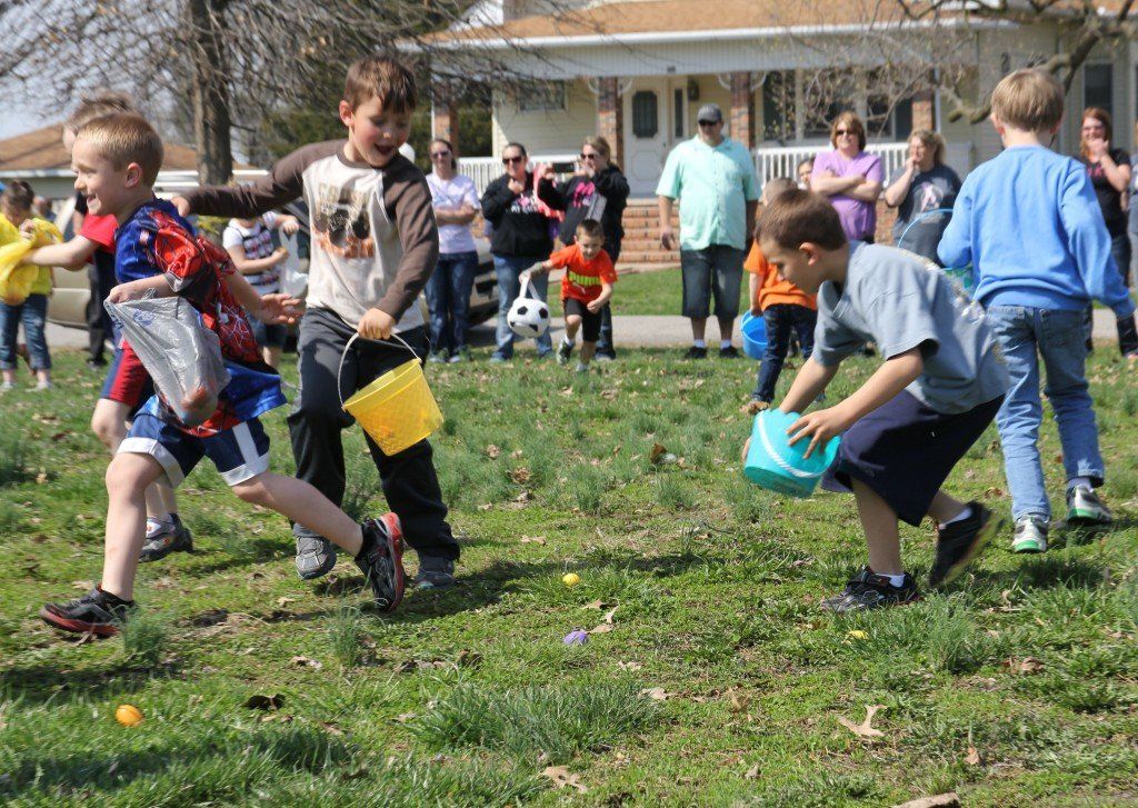 Kids scatter to try and grab the most Easter eggs during Gillespie's annual egg hunt. 