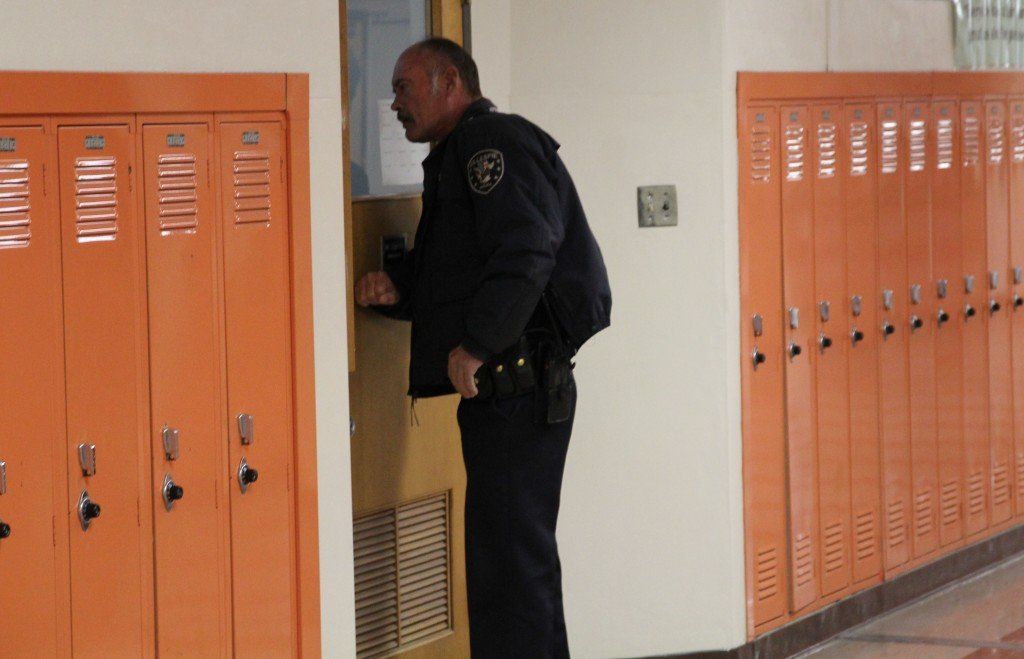 Officer Hearn attempts to evacuate a middle school classroom. 