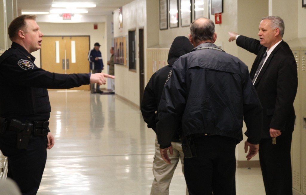 Chief of Police Jared DePoppe and Superintendent Joe Tieman discuss the route they will take as Officer Hearn and Officer Bradford stand by during the active shooter drill held Wednesday morning. Read more here.