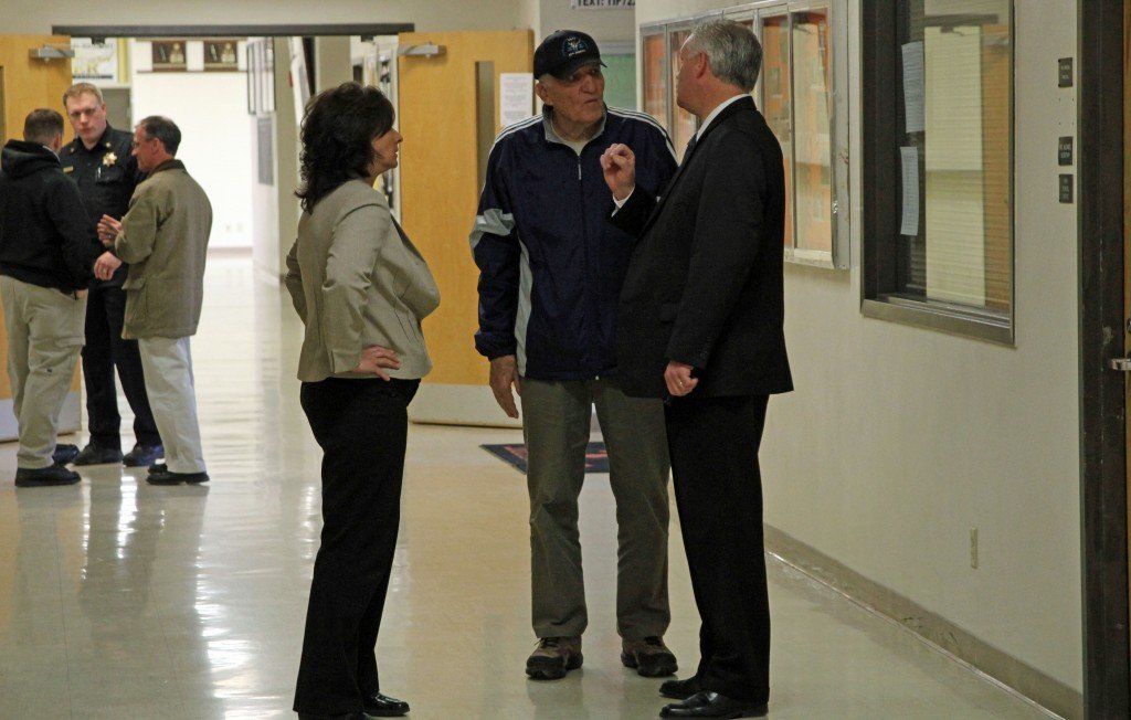 Superintendent Joe Tieman talks with school board members Don Dobrino and Jenni Alepra following the active shooter drill. 