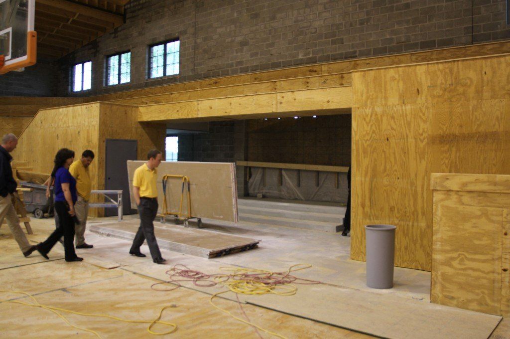 Board members check out the new gently sloped floor and open floor plan. 