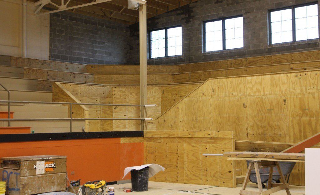 A look up into the corners of the gym which no longer feature a staircase separating the seating areas. 