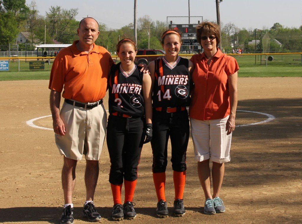 Seniors Molly and Ellen Gray were recognized last weeks as the softball team's only two seniors. The girls pose with their parents, Kevin and Elaine Gray. 