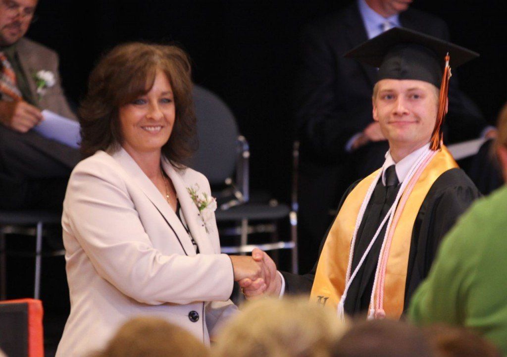 Jenni Alepra awards Zachary Taylor with the Student of the Year Award.
