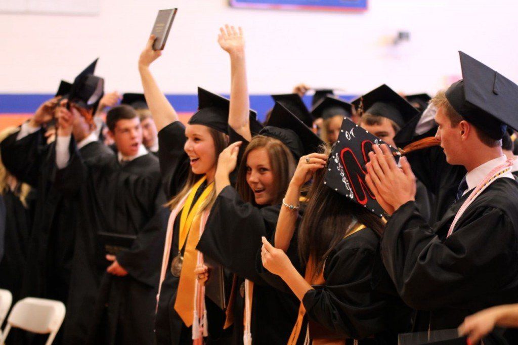 Seniors cheered and tossed their caps in the air as they were announced as the Class of 2014.