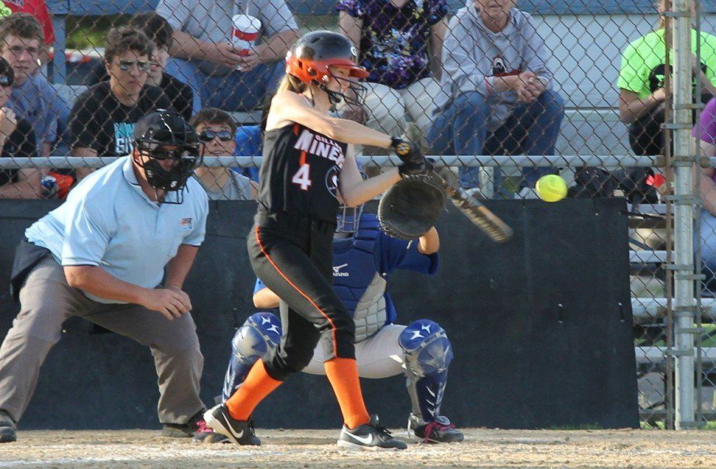 Bette Hammann hits a walk off double to give the Miner softball team a 2-1 victory over Greenville last Wednesday evening. 