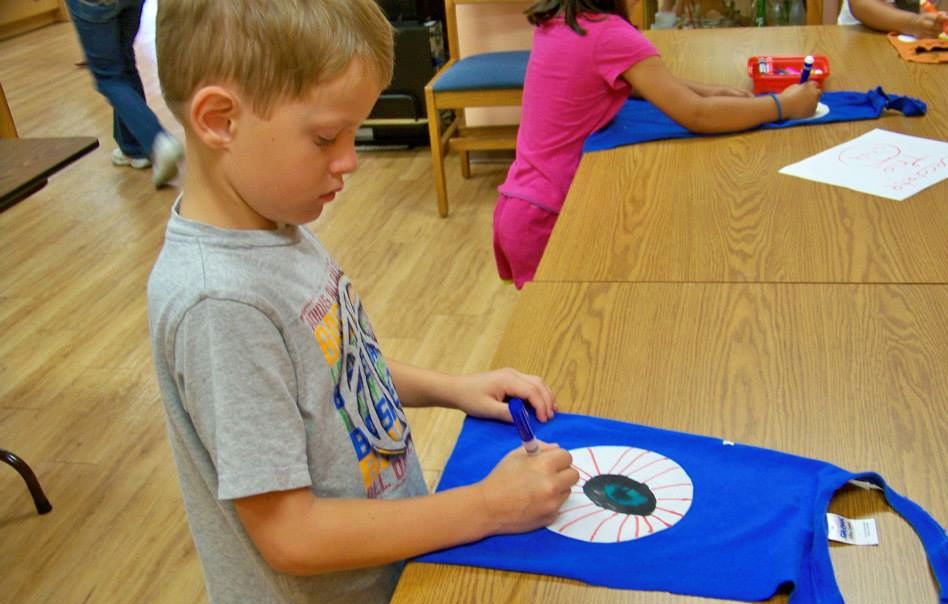 Tristan Wargo builds a Lego creation this week at the Benld Library during the Lego Club. 