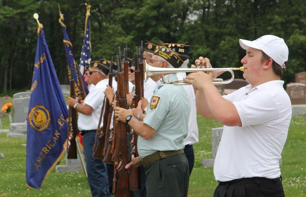 CJ Meno plays taps during the Benld Memorial Day service. 