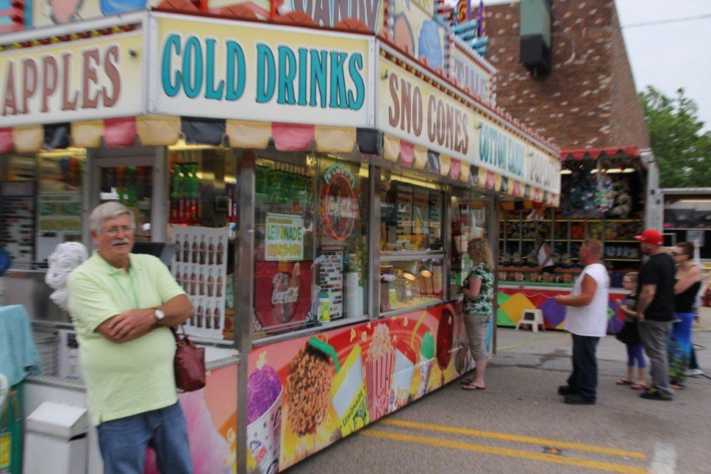 Carnival attendees wait in line to grab their favorite carnival treat.