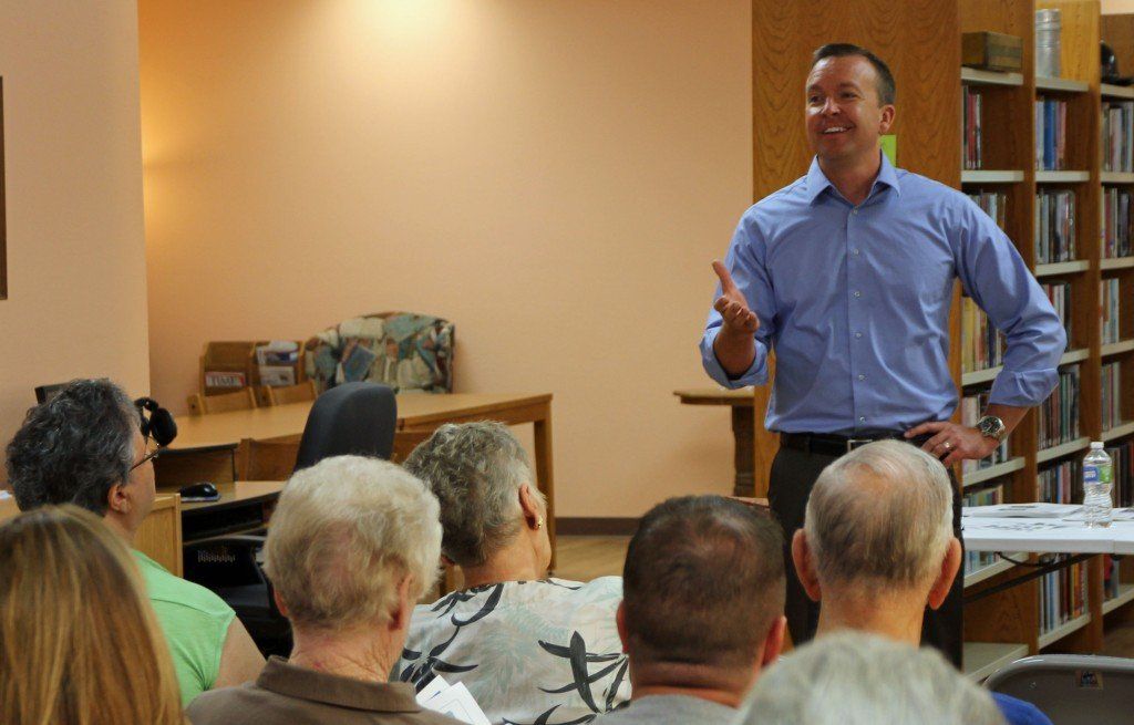 Senator Andy Manar laughs with residents during his "Capitol on Your Corner" discussion at Benld Library.