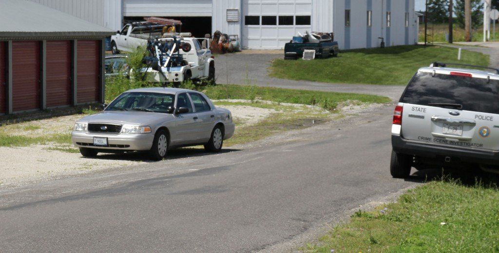 Gillespie Police officers and crime scene technicians from the Illinois State Police investigate criminal damage reports to the Gillespie Mini Storage facility on Southern Street. 