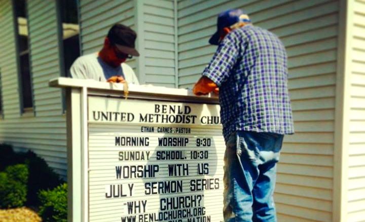 Volunteers do some painting and touch up work around the Benld United Methodist Church last week. 