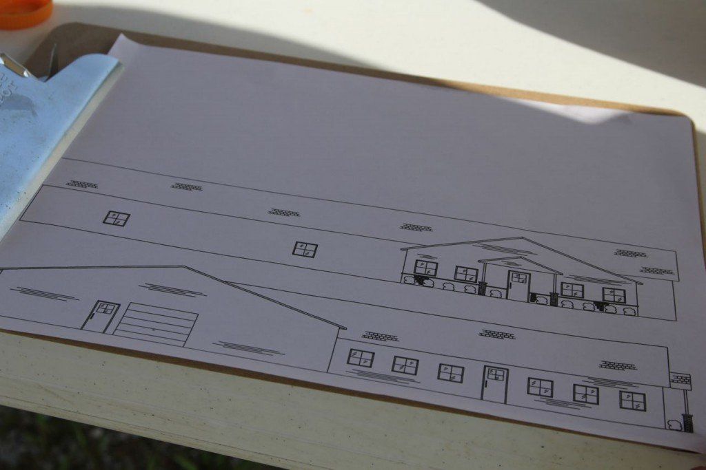 Brian Bequette displays his sketches for his new business coming he's bringing into Benld. 