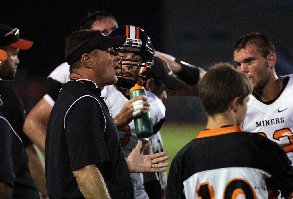 Coach Don Borgini explains the game plan to his players during a timeout Friday.
