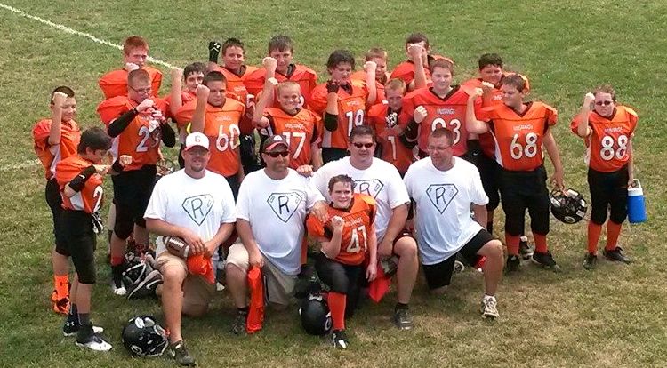 The 7th grade Mustang team displays their support for the Redmon family yesterday. 