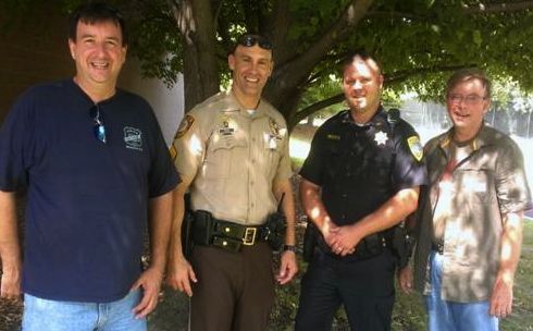The men who dropped off the second load of donations is pictured with Sgt. Jeremy Romo. From L-R: Jim Goldasich, St. Louis County Missouri Police Sergeant Jeremy Romo, Mt. Olive Illinois Police Chief Ryan Dugger and Paul Goldasich.