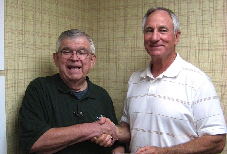 John Fassero (right) accepts $500 donation from Jim Pickett