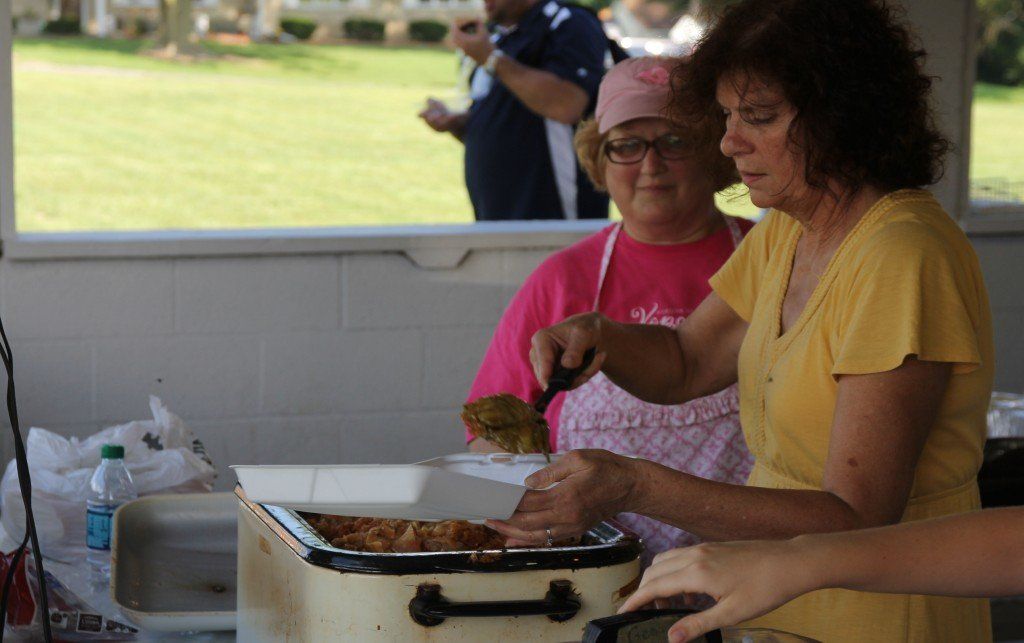CFU Lodge #217 members serve up a take-home container of their famous cabbage rolls during their 81st annual picnic last Sunday.
