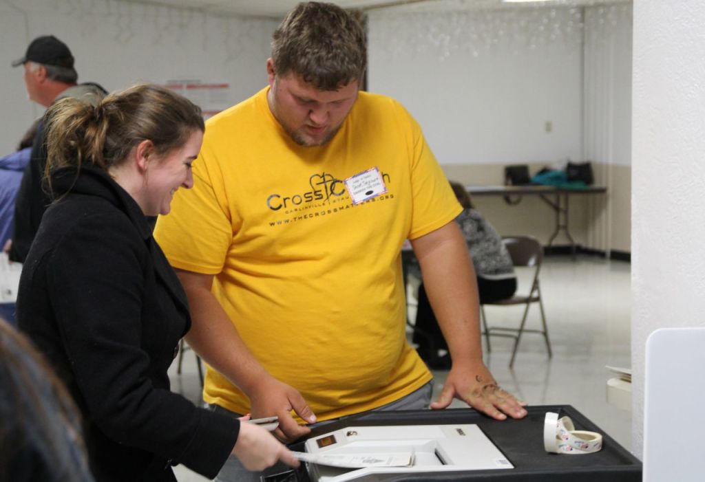 Audrey Dewey submits her ballot during the election on Tuesday of last week. 