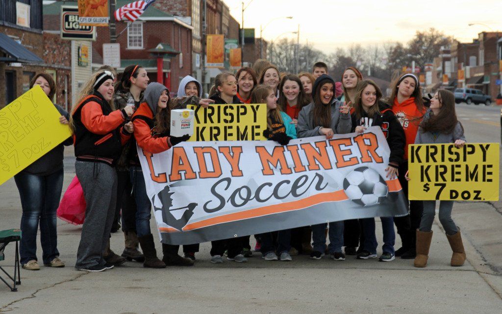 The Lady Miner soccer team enjoyed the warmer temperatures Saturday morning while they sold Krispy Kreme donuts as part of a fundraiser for the parent-funded sport. 