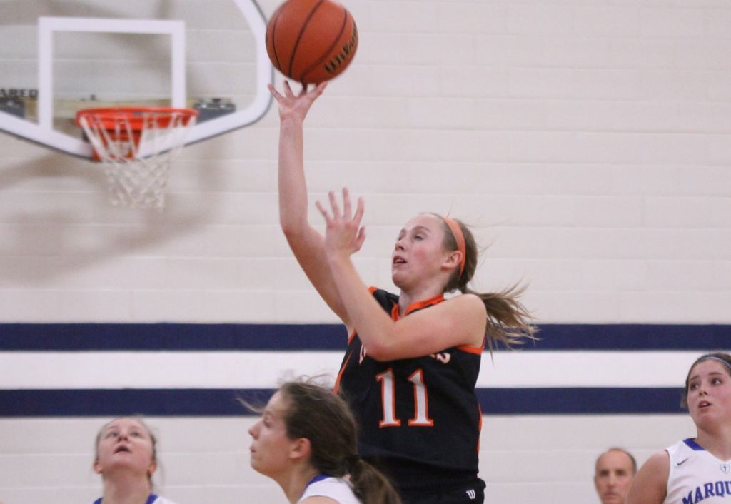 Amanda Schmidt soars above the rest to score two points in the Lady Miner's loss to Alton Marquette last week.