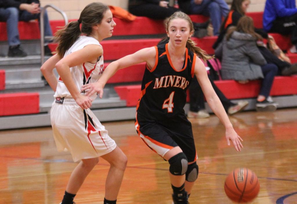 Bette Hammann attempts to dribble around her defender. 