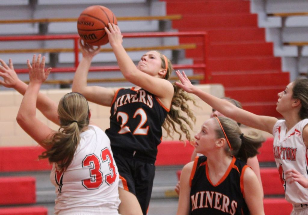 Addison Bryant rises above the Staunton defenders for an easy basket. 