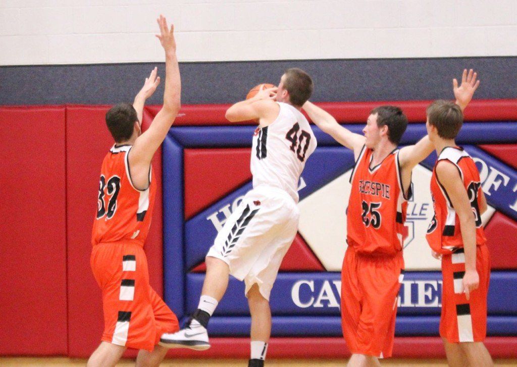Quentin Zenner (left) and Jacob Alepra (right) play tough post defense on Lincolnwood.