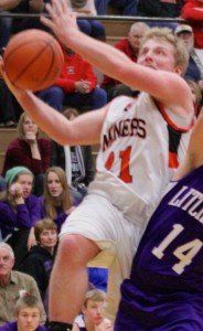 Eli Fox goes up and over his defender to score a layup and a free throw to lead the Miners into halftime.