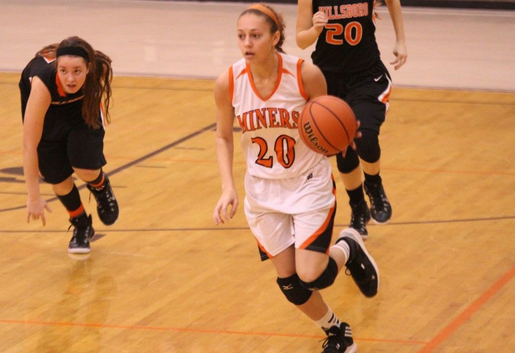 Diana Lienemann dribbles the ball up the court for the Lady Miners in Gillespie's game versus Hillsboro last week. 