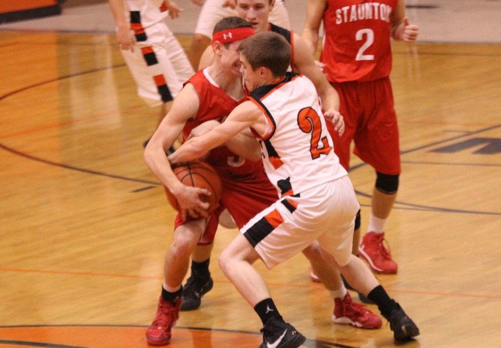 Colin Tieman plays a tough defense and grabs the ball away from his Staunton opponent.